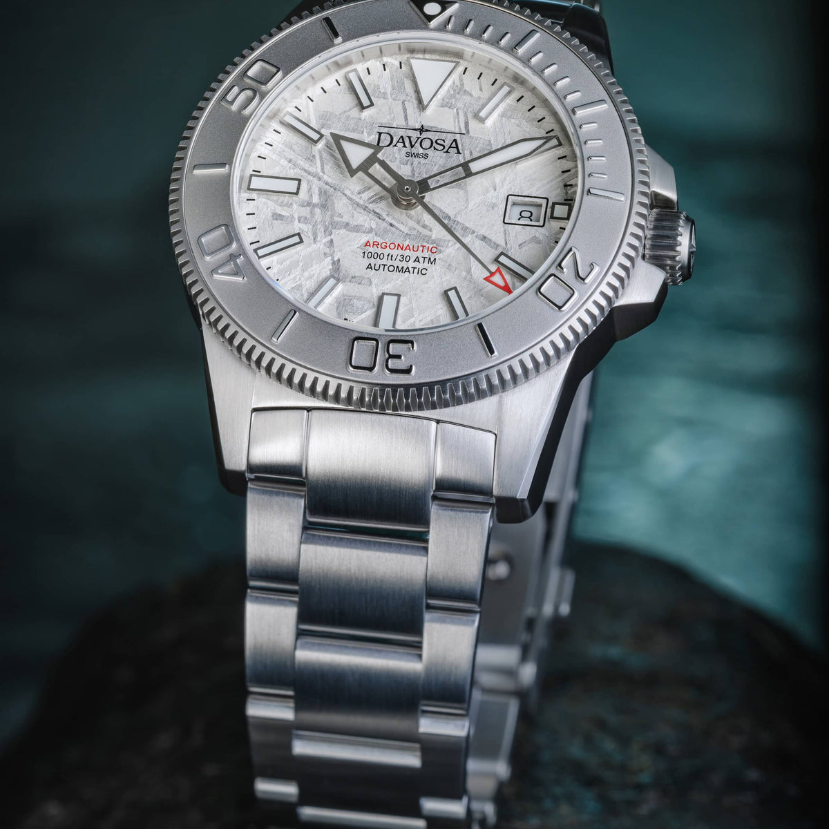 Davosa Argonautic Meteorite diver watch standing on its TriaLink bracelet, three-quarter view of the meteorite dial