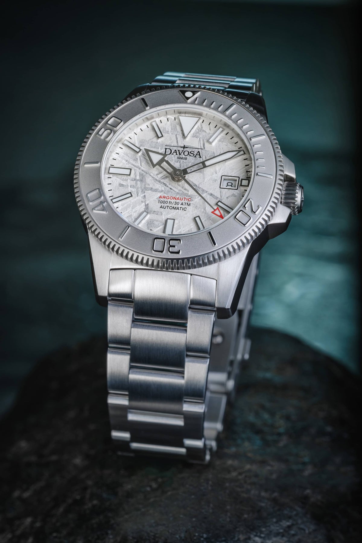 Davosa Argonautic Meteorite diver watch standing on its TriaLink bracelet, three-quarter view of the meteorite dial