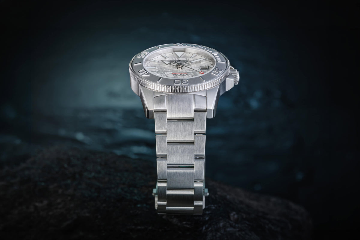 Davosa Argonautic Meteorite 300m automatic diver watch standing upright on its stainless steel bracelet, low-angle view